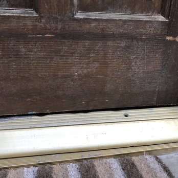 Flooring Pro - Cut front door, after repair was attempted - Flooring Near Me - North Hollywood, California
