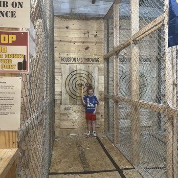 Houston Axe Throwing - His first bullseye! - Axe Throwing Near Me - Houston, Texas