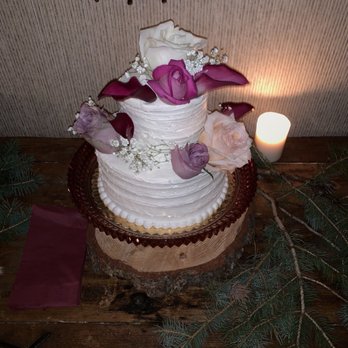 Safeway - a wedding cake with flowers and a candle - Grocery Near Me - Estes Park, Colorado Safeway - a wedding cake with flowers and a candle - Grocery Near Me - Estes Park, Colorado