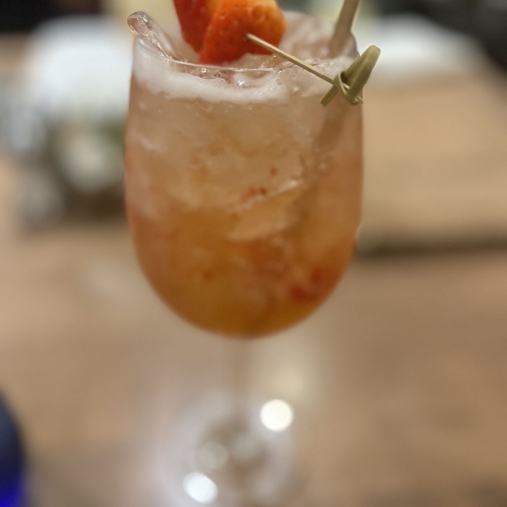 Atlantic Grille - a close up of a drink with strawberries - Seafood Near Me - Palm Coast, Florida