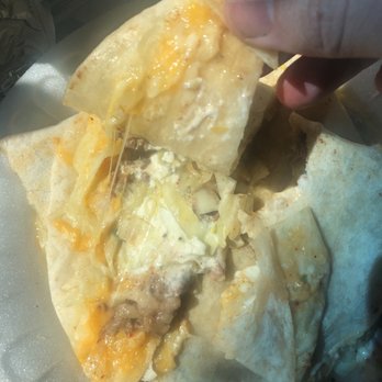 Tacos Las Koritas - a hand holding a tortilla - Food Trucks Near Me - Los Molinos, California Tacos Las Koritas - a hand holding a tortilla - Food Trucks Near Me - Los Molinos, California