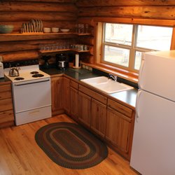 Lonesome Duck - Rivers Edge kitchen, open plan to living room and dining room.  Views to lawn, hammock and river.