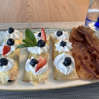 Vue - Strewberry and blueberry stuffed crepes, along with warm maple syrup and crispy bacon--Yummm! - Wraps Near Me - Fort Myers, Florida Vue - Strewberry and blueberry stuffed crepes, along with warm maple syrup and crispy bacon--Yummm! - Wraps Near Me - Fort Myers, Florida