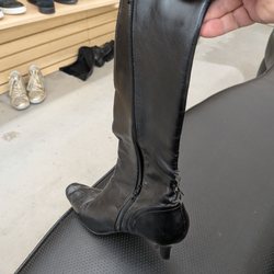 Hope of the Valley Thrift Store - Old tired, peeling, wrinkled boots priced at $16.99