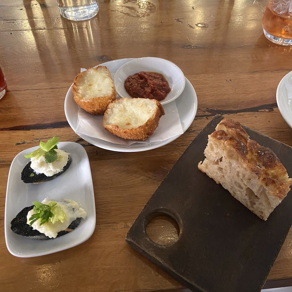 SRV Boston - Arancini (top), Baccala Mantecato (left), focaccia (right) - Italian Near Me - Boston, Massachusetts SRV Boston - Arancini (top), Baccala Mantecato (left), focaccia (right) - Italian Near Me - Boston, Massachusetts