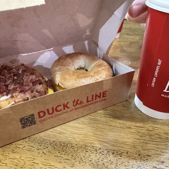 Duck Donuts - Bacon, Egg, and Cheese bagel and a sausage egg and cheese on a doughnut sprinkled. - Donuts Near Me - San Antonio, Texas