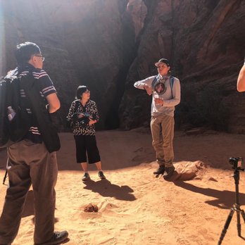 Taadidiin Tours - Marcus giving us a quick explanations on canyon's formation - Walking Tours Near Me - Page, Arizona Taadidiin Tours - Marcus giving us a quick explanations on canyon's formation - Walking Tours Near Me - Page, Arizona