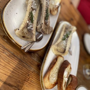Asadero Prime - Fire roasted extra-long bone marrow canoe with cotija cheese, served with crostini - Mexican Near Me - Kent, Washington Asadero Prime - Fire roasted extra-long bone marrow canoe with cotija cheese, served with crostini - Mexican Near Me - Kent, Washington