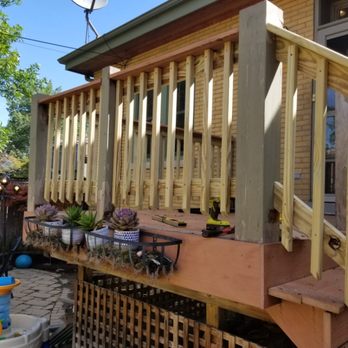 Miranda's Remodeling - a porch with stairs and railings - Flooring Near Me Miranda's Remodeling - a porch with stairs and railings - Flooring Near Me