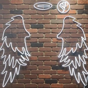 Santo Placer - Neon angel wings near the entrance - Steakhouses Near Me - San Diego, California Santo Placer - Neon angel wings near the entrance - Steakhouses Near Me - San Diego, California