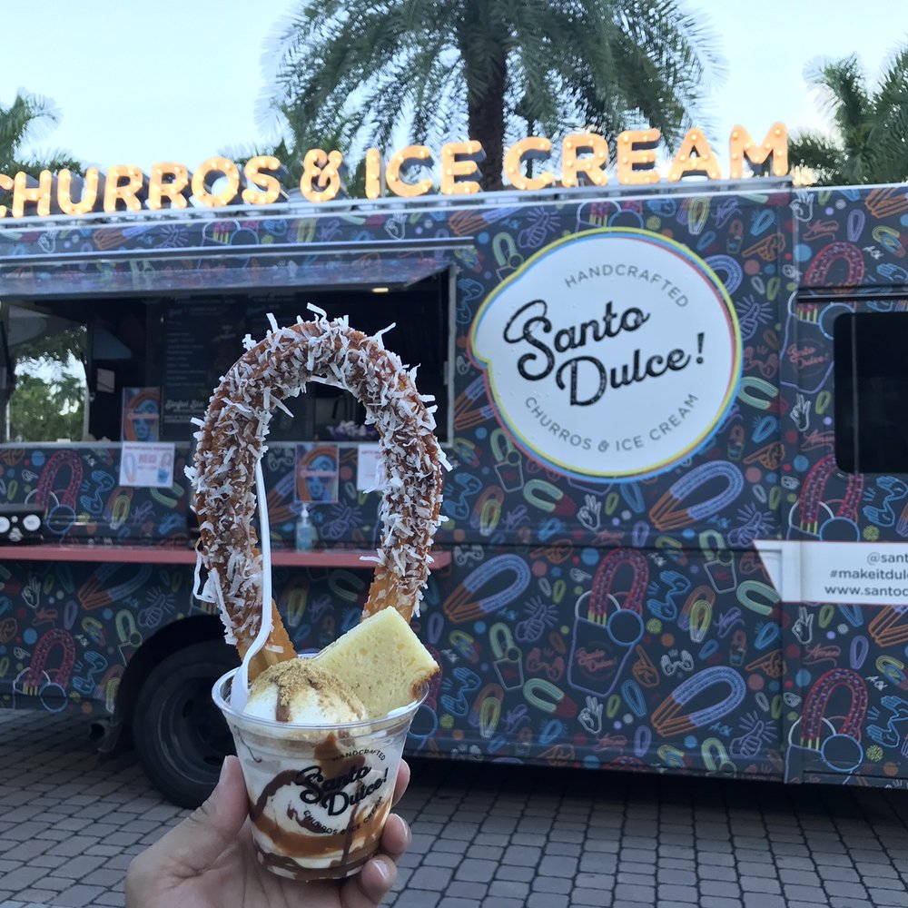 Santo Dulce Churros - Sundae: Halo with Dulce de Leche and Coconut along with the Santo De Leches Ice cream - Desserts Near Me - Miami, Florida Santo Dulce Churros - Sundae: Halo with Dulce de Leche and Coconut along with the Santo De Leches Ice cream - Desserts Near Me - Miami, Florida