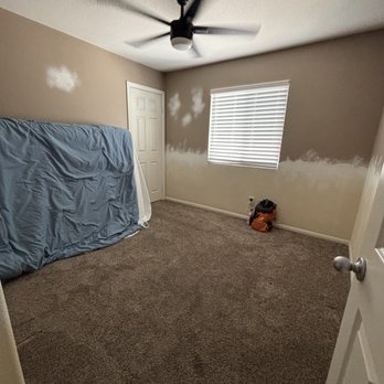 E & M Handy Services - Before: Bedroom - emptied, wainscoting and wood trim removed, damaged walls and dark paint. - Handyman Near Me - Menifee, California E & M Handy Services - Before: Bedroom - emptied, wainscoting and wood trim removed, damaged walls and dark paint. - Handyman Near Me - Menifee, California
