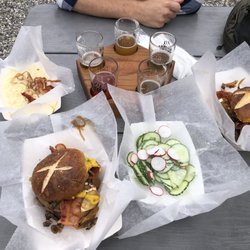 Smash burgers, cucumber salad, spaetzle Mac n cheese, flight of Gneiss beers