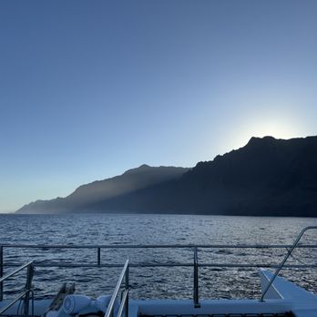 Holoholo Charters - The sun rising behind the might mountains! - Boating Near Me - Eleele, Hawaii