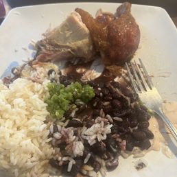 Chicken leg, rice black beans.