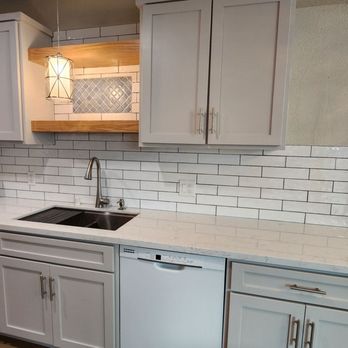 Prestige Tile Works - White textured Subway Tile with a mini version of Over-the-range Inset on opposite side in Blue Lantern Pattern. - Flooring Near Me Prestige Tile Works - White textured Subway Tile with a mini version of Over-the-range Inset on opposite side in Blue Lantern Pattern. - Flooring Near Me