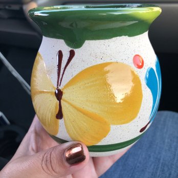 La Oaxquena - a hand holding a yellow and green vase - International Grocery Near Me - Santa Rosa, California La Oaxquena - a hand holding a yellow and green vase - International Grocery Near Me - Santa Rosa, California