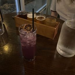 a purple drink with a straw a purple drink with a straw