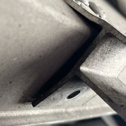 Caliber Collision - Missing rivet, stretched rivets and bent bracket.