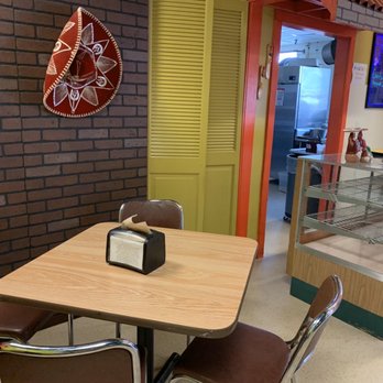 Hector's Cocina - a table with a clock on it - Mexican Near Me - Oregon, Illinois