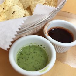 Indo Asian Cuisine - Homemade papadum with turmeric and cilantro dipping sauces.