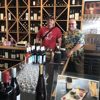 Punta Gorda Chocolate & Wine - Seth Harvey chatting up my happy husband after the wine tasting. All those little glasses are waiting on you. - Chocolatiers & Shops Near Me - Punta Gorda, Florida Punta Gorda Chocolate & Wine - Seth Harvey chatting up my happy husband after the wine tasting. All those little glasses are waiting on you. - Chocolatiers & Shops Near Me - Punta Gorda, Florida