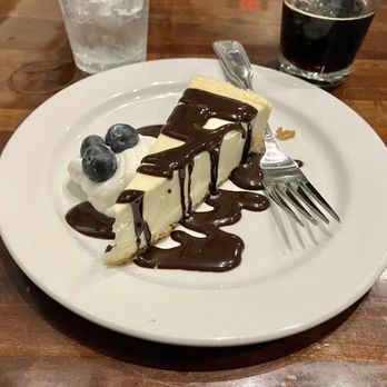 The Library Restaurant & Pub - Cheesecake w/ chocolate sauce - Steakhouses Near Me - Indianapolis, Indiana The Library Restaurant & Pub - Cheesecake w/ chocolate sauce - Steakhouses Near Me - Indianapolis, Indiana