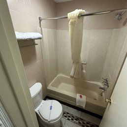Clean bathroom, with toiletries provided and a freshly mopped floor Clean bathroom, with toiletries provided and a freshly mopped floor