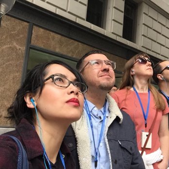 Seattle Architecture Foundation - On the tour wearing the ear pieces with adjustable volume on the necklace - Architectural Tours Near Me - Seattle, Washington Seattle Architecture Foundation - On the tour wearing the ear pieces with adjustable volume on the necklace - Architectural Tours Near Me - Seattle, Washington