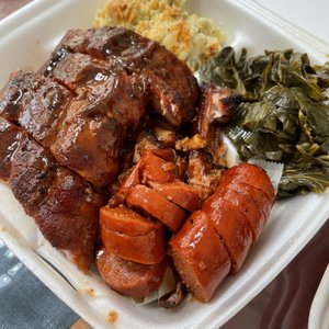Photo of Bowlegged BBQ - San Diego, CA, United States. Sampler plate: ribs rib tips and sausage with greens and potato salad
