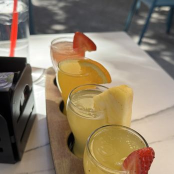 Broken Yolk Cafe - Tropical mimosa flight. Subbed guava with orange - Breakfast & Brunch Near Me - Irvine, California