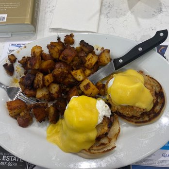 Grumpy's Restaurant - Fried Green Tomato Benedict with potatoes and freshly squeezed orange juice - Breakfast & Brunch Near Me - St. Johns, Florida Grumpy's Restaurant - Fried Green Tomato Benedict with potatoes and freshly squeezed orange juice - Breakfast & Brunch Near Me - St. Johns, Florida