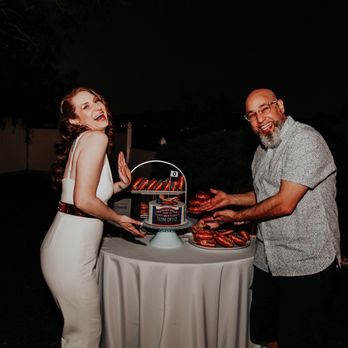 The Pin-up Kitchen - The bride and groom showing off Chicago Cubs grooms cake - Cupcakes Near Me
