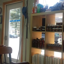 Yankee Clipper Barbershop - A nice, well lit waiting area with a nice selection of hair care products.