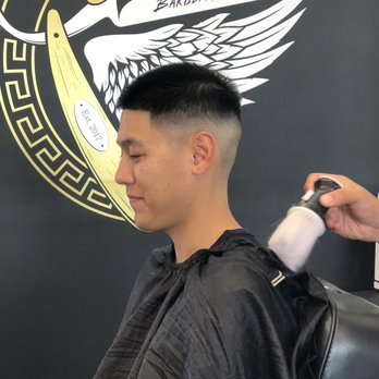 Certified Cutz Barbershop - brushing off loose hairs - Barbers Near Me - San Leandro, California