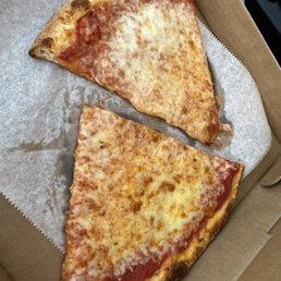 two slices of pizza in a box