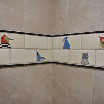 Fidelium Renovations - Hand crafted wildlife tile for accent strip in shower remodel - General Contractors Near Me Fidelium Renovations - Hand crafted wildlife tile for accent strip in shower remodel - General Contractors Near Me
