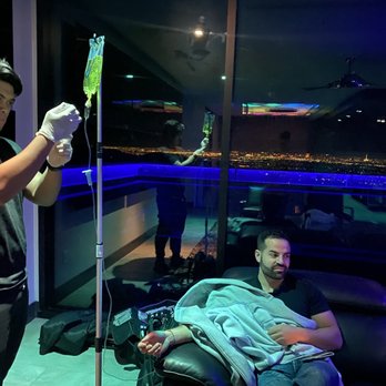 LIV Wellness - Curvy giving my friend the infamous Myers Cocktail - IV Hydration Near Me - Las Vegas, Nevada
