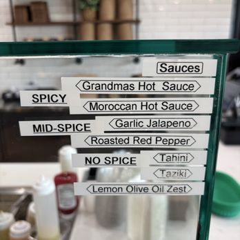 Hummus Republic - Different sauces. I tried Taziki and Lemon Olive Oil Zest. Also tasted Grandmas Hot Sauce! - Mediterranean Near Me - Turlock, California