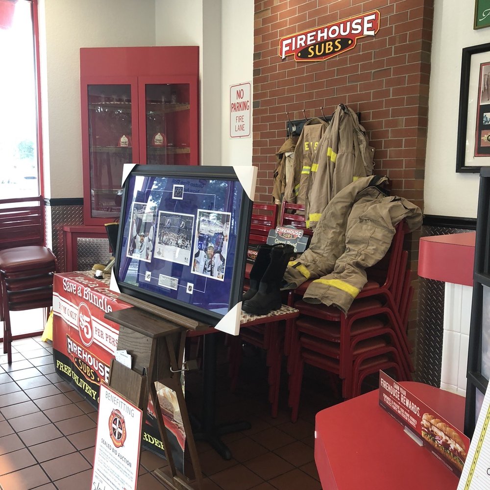 Firehouse Subs - a fireman's uniform on display - Sandwiches Near Me - Valrico, Florida