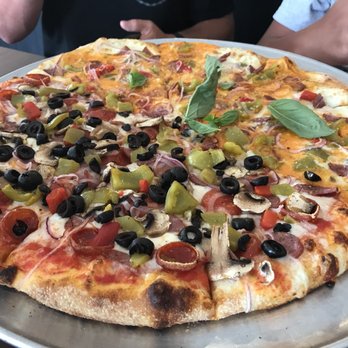 Flat Earth Pizza - You are able to split your pizza toppings. - Pizza Near Me - Carson City, Nevada