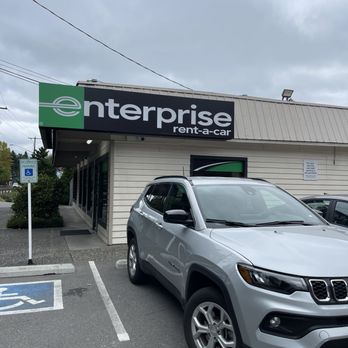Enterprise Rent-A-Car - Front door from the parking lot + a rental car - Car Rental Near Me - Bothell, Washington