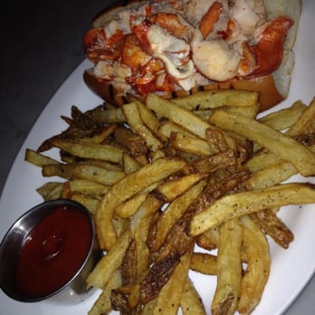 Neptune Oyster - Lobster roll served hot with a side of fries $27 - Seafood Near Me - Boston, Massachusetts Neptune Oyster - Lobster roll served hot with a side of fries $27 - Seafood Near Me - Boston, Massachusetts