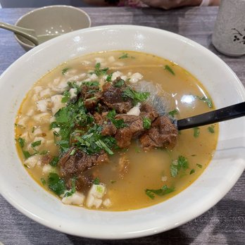 Xi'an Cuisine - 22. Beef Flatbread in Soup The broth is out of this world! The beef is incredibly tender and delicious! - Chinese Near Me - Naperville, Illinois Xi'an Cuisine - 22. Beef Flatbread in Soup The broth is out of this world! The beef is incredibly tender and delicious! - Chinese Near Me - Naperville, Illinois