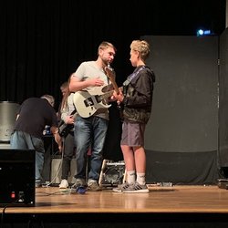 Kyle McCann Guitar, Bass, and Ukulele lessons - Kyle with a student