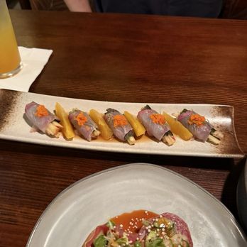 Kenichi Pacific - Hamachi crudo with honey crisp apple, shiso, and orange. Shrimp tempura roll on soy paper. - Sushi Bars Near Me - Kailua-Kona, Hawaii Kenichi Pacific - Hamachi crudo with honey crisp apple, shiso, and orange. Shrimp tempura roll on soy paper. - Sushi Bars Near Me - Kailua-Kona, Hawaii