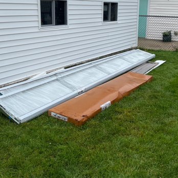 Sunnyside Roofing - Garage doors left in the backyard uninstalled for about 2 weeks. - Roofing Near Me - Chicago, Illinois Sunnyside Roofing - Garage doors left in the backyard uninstalled for about 2 weeks. - Roofing Near Me - Chicago, Illinois