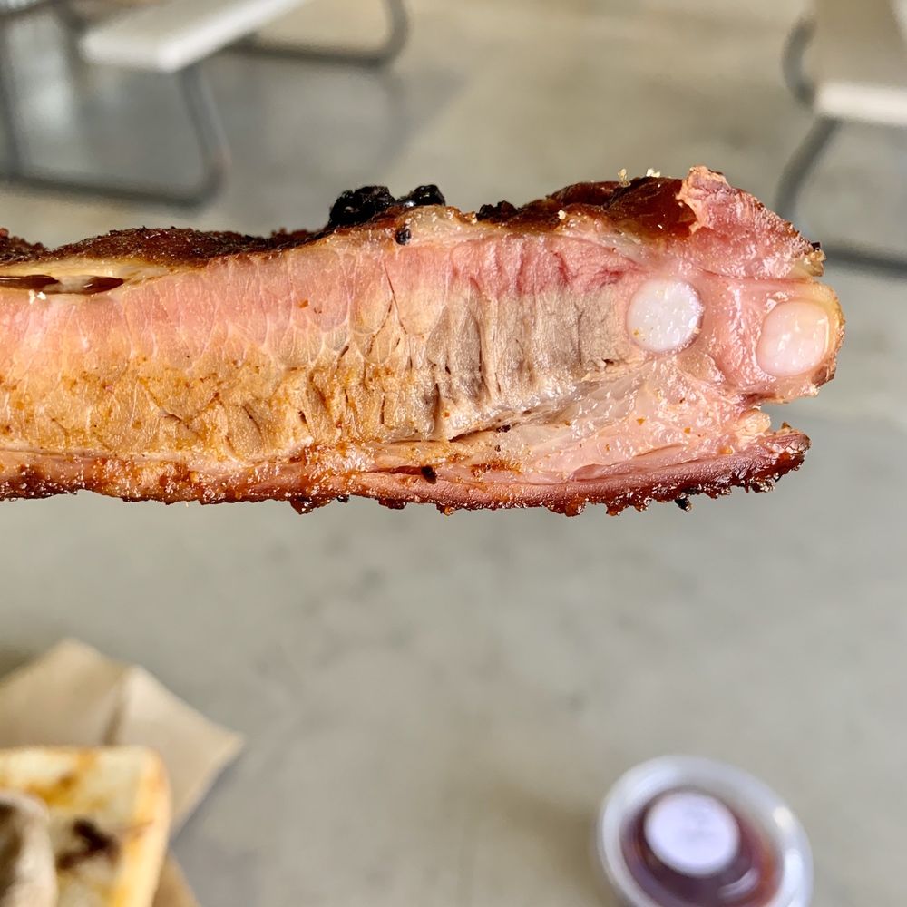 Jo-Bawb's BBQ - a hand holding a piece of bacon - Barbeque Near Me - Oklahoma City, Oklahoma Jo-Bawb's BBQ - a hand holding a piece of bacon - Barbeque Near Me - Oklahoma City, Oklahoma