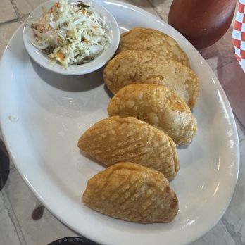 Reyes Bar & Restaurant - Pastelitos filled with chicken and veggies, side of curtido and red salsa - Salvadoran Near Me - Woodbridge, California Reyes Bar & Restaurant - Pastelitos filled with chicken and veggies, side of curtido and red salsa - Salvadoran Near Me - Woodbridge, California