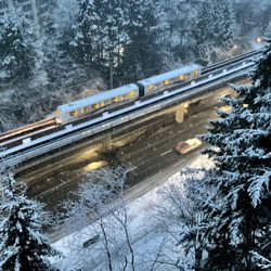 SkyTrain - .. Skytrain rail above, Lougheed Highway below .. snowy last day of February.